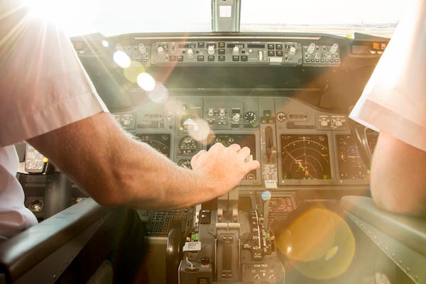 Pilots in cockpit before takeoff