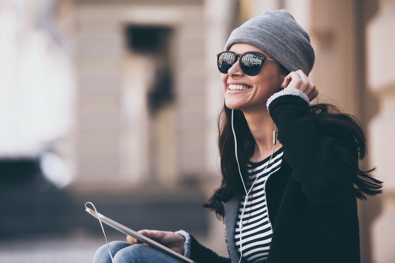woman listening to podcast