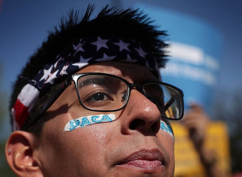 Pro-immigration activist Omar Martinez attends a rally in front of the U.S. Supreme Court