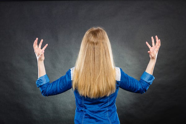 Furious woman making hands gestures