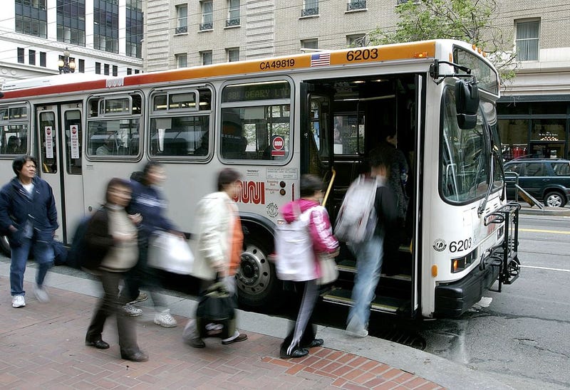Passengers board a MUNI bus along Market Street April 25, 2006 in San Francisco, California.