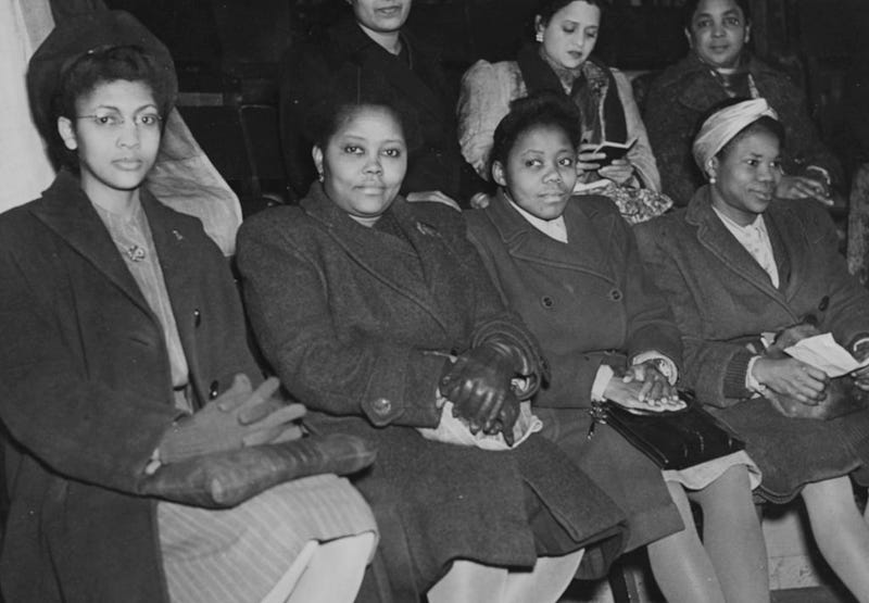Delegates from all over the world at a meeting to celebrate International Women's Day; (L-R) Marie Campbell (Jamaica), Miss Hazeley (Sierra Leone), Miss Inyang (Nigeria) and Miss Ikpeme (Nigeria), London, March 8th 1947.