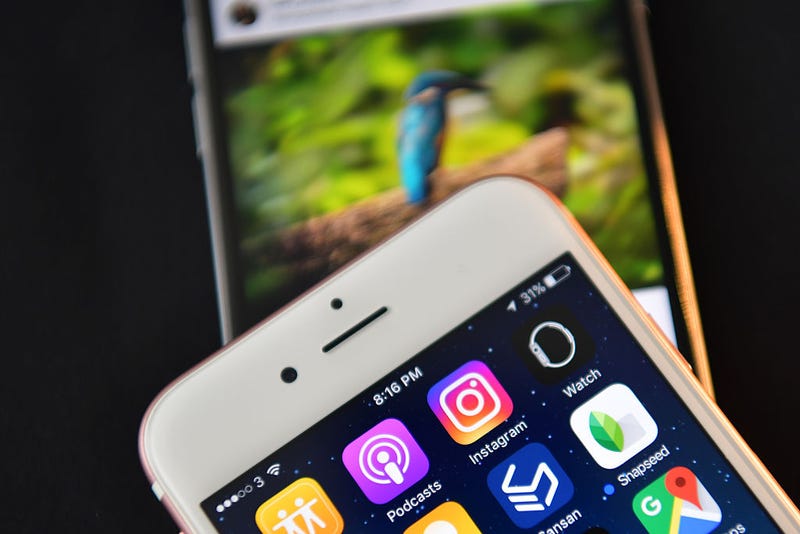 The Instagram app logo is displayed next to an "Instagrammed" image on another iPhone on August 3, 2016 in London, England.