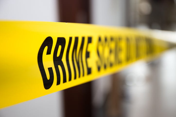 crime scene tape in building with blurred background