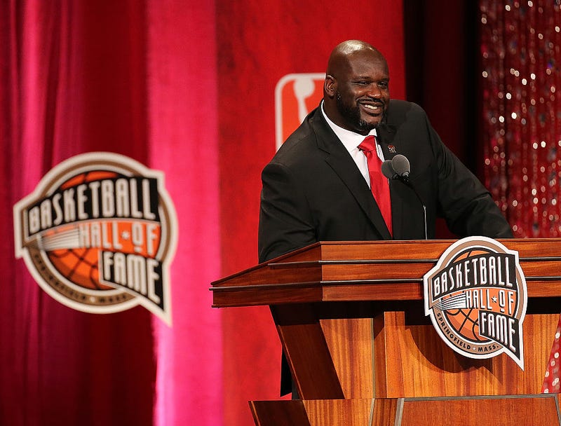 Shaquille O'Neal speaks at a Hall of Fame ceremony.