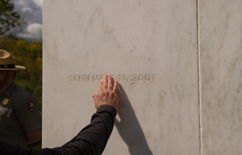SHANKSVILLE, PA - SEPTEMBER 11: A visitor traces the date etched in a marble slab on the Wall of Names at the Flight 93 National Memorial before the 15th Anniversary of the September 11th terrorist attacks, September 11, 2016 in Shanksville, PA. United Airlines Flight 93 crashed into a field outside Shanksville, PA with 40 passengers and 4 hijackers aboard on September 11, 2001.