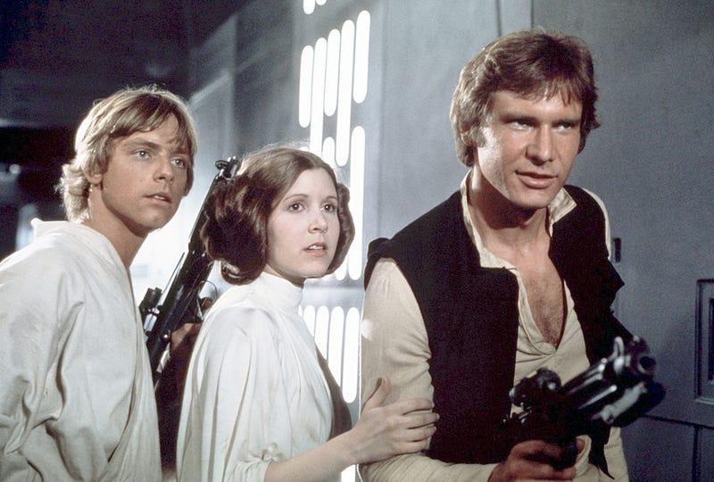 Mark Hamill, Carrie Fisher and Harrison Ford on the set of Star Wars: Episode IV - A New Hope written, directed and produced by George Lucas.