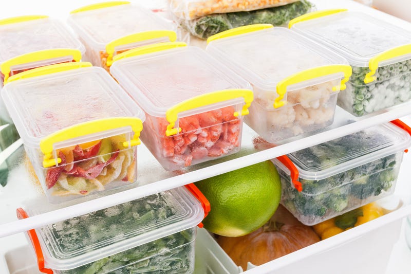 A fridge full of lots of containers of food