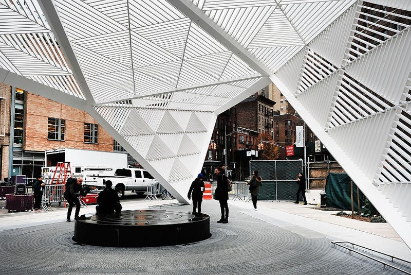 People walk through a new memorial to honor victims of the AIDS epidemic which was dedicated on World AIDS Day on December 1, 2016 in New York City.