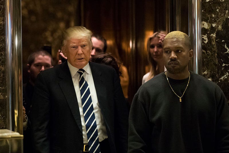 President-elect Donald Trump and Kanye West exit an elevator and walk into the lobby at Trump Tower, December 13, 2016 in New York City. President-elect Donald Trump and his transition team are in the process of filling cabinet and other high level positions for the new administration. (Photo by Drew Angerer/Getty Images)