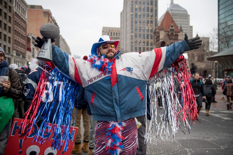 patriots fan celebrating in boston