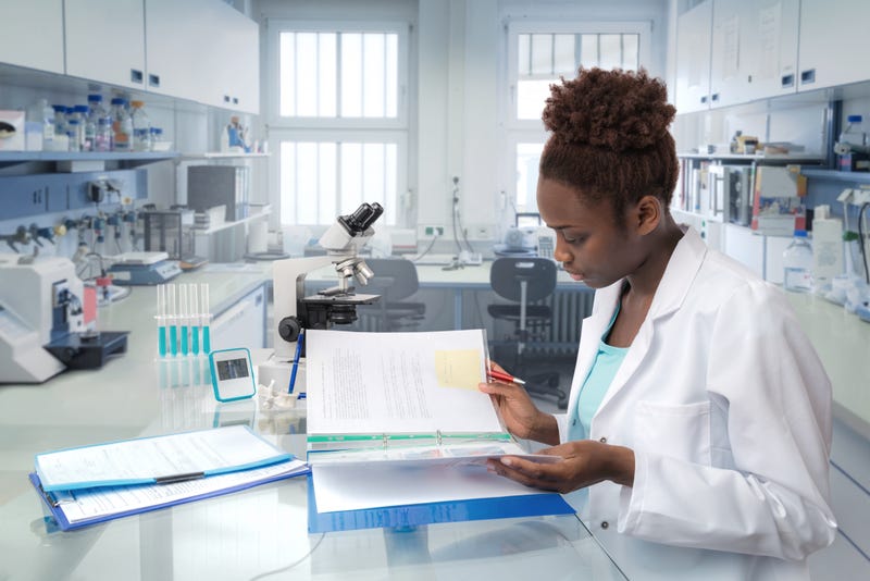 scientist looks at binder