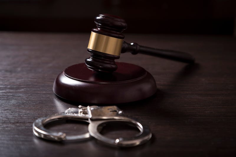 Gavel and handcuffs stock photo.