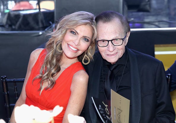 Shawn and Larry King pose for a photo.