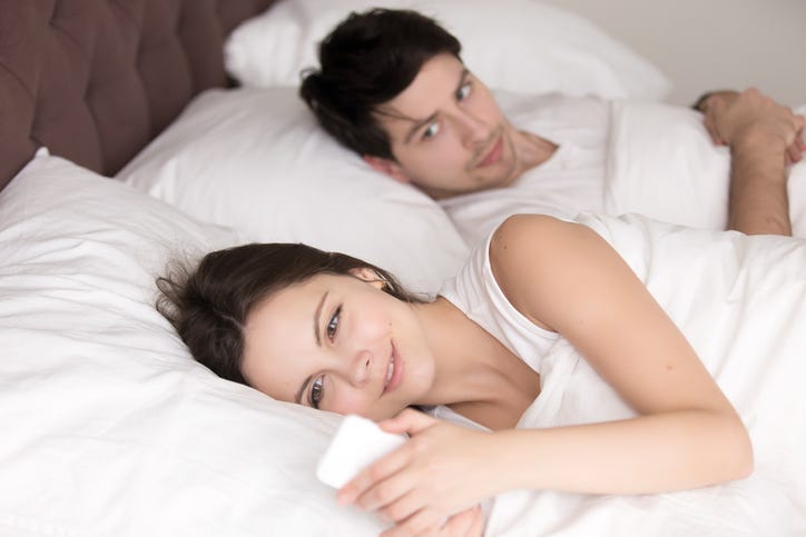 Woman texting another man