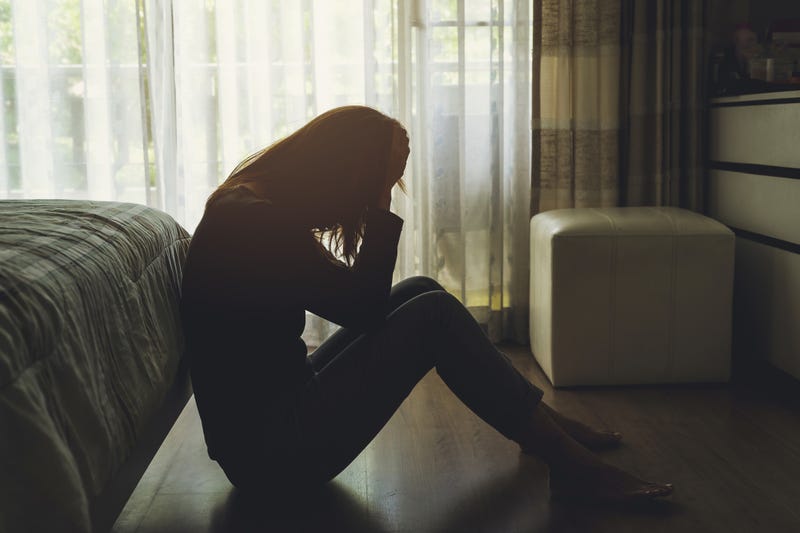 Woman holding head silhouette stock image.
