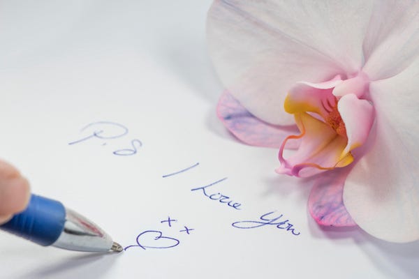 Person writing love letter