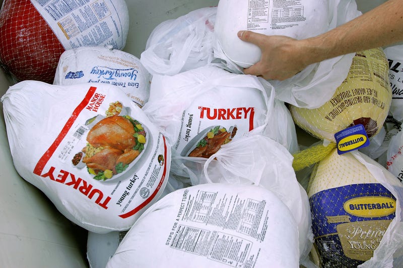A volunteer prepares a box of turkeys to be given out during the 2006 holiday turkey distribution at the San Francisco Food Bank November 21, 2006 in San Francisco, California.