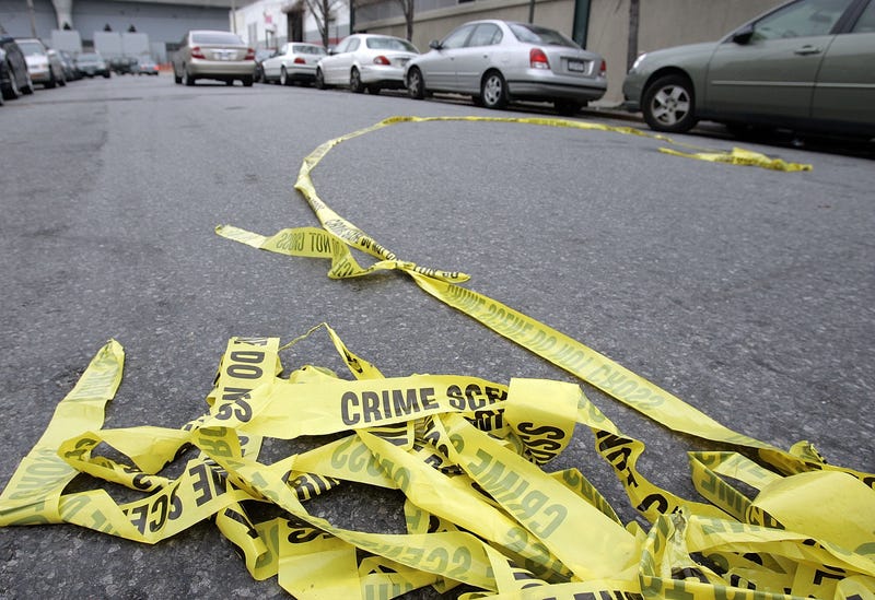 NEW YORK - NOVEMBER 28: Police crime scene tape lies in the street outside Club Kalua club where Sean Bell was shot and killed November 28, 2006 in Jamaica, Queens, New York City. Sean Bell was killed and two friends wounded when New York City police fired 50 shots at them outside a strip club after Bell's bachelor party. (Photo by Stephen Chernin/Getty Images)