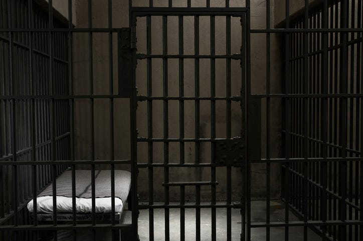 Empty jail cell.