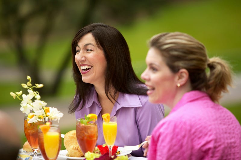 women drinking mimosas