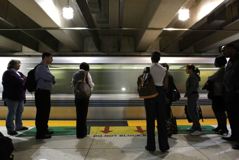 Bay Area Rapid Transit (BART) passengers stand on the platform as a train pulls into the Powell Street station May 12, 2008 in San Francisco, California.