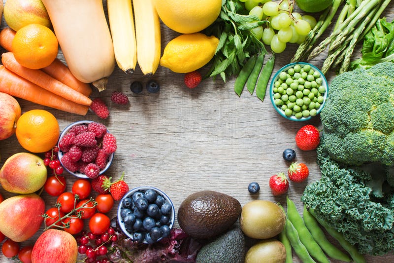 Different fruits and vegetables on wooden table