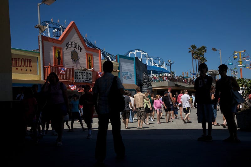 Visitors walk on the Santa Cruz Boardwalk on July 3, 2008 in Santa Cruz, California.