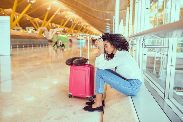 black Woman upset and frustrated at the airport