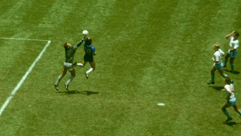 Argentina player Diego Maradona outjumps England goalkeeper Peter Shilton to score with his 'Hand of God' goal as England defenders Kenny Sansom (top) Gary Stevens (c) and Terry Fenwick look on during the 1986 FIFA World Cup Quarter Final at the Azteca Stadium on June 22, 1986 in Mexico City, Mexico.