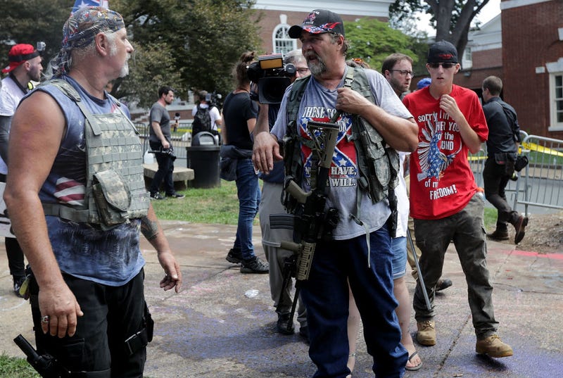 White nationalists, neo-Nazis, the KKK and members of the "alt-right" attempt to organize inside Emancipation Park during the Unite the Right rally August 12, 2017 in Charlottesville, Virginia. After clashes with anti-facist protesters and police the rally was declared an unlawful gathering and people were forced out of Lee Park, where a statue of Confederate General Robert E. Lee is slated to be removed. (Photo by Chip Somodevilla/Getty Images)
