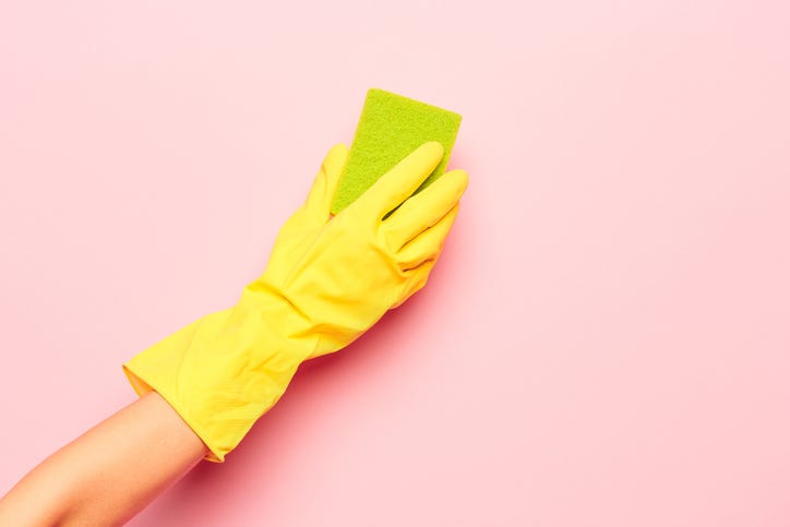 person cleaning wall