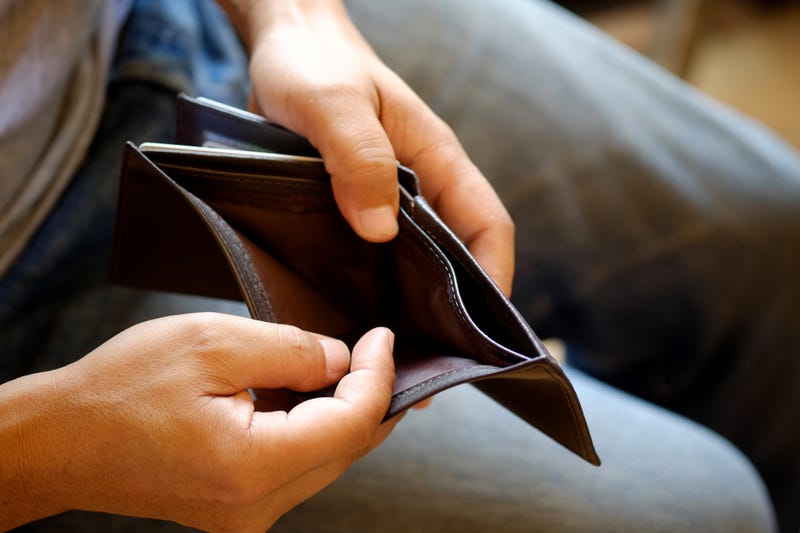man opening empty wallet