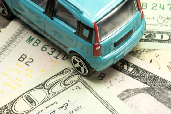 Car on money.