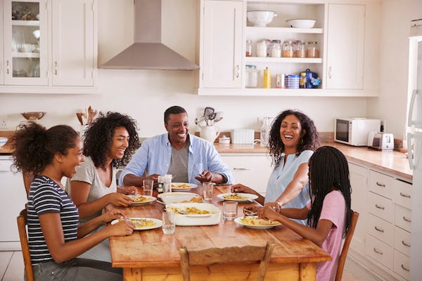 Family having dinner in the kitchen