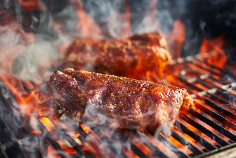 meat on grill with fire flare up