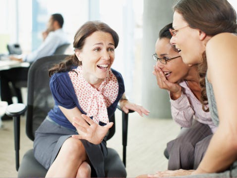 Women gossiping at the office
