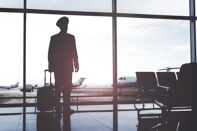 Silhouette of pilot at airport