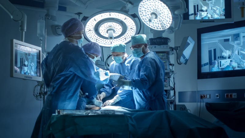 Medical team performs a surgical operation.