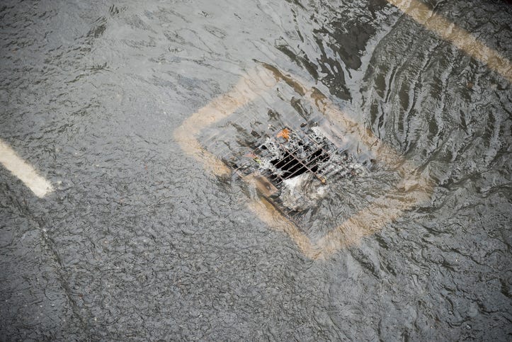 storm drain with debris and trash