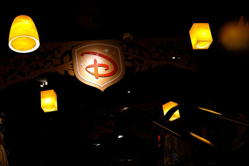 A Disney logo is displayed inside the Disney Store in Times Square
