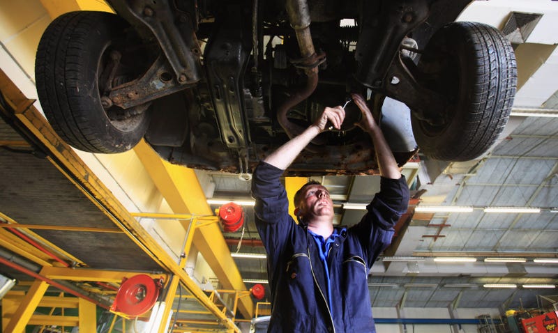 Mechanic working on car