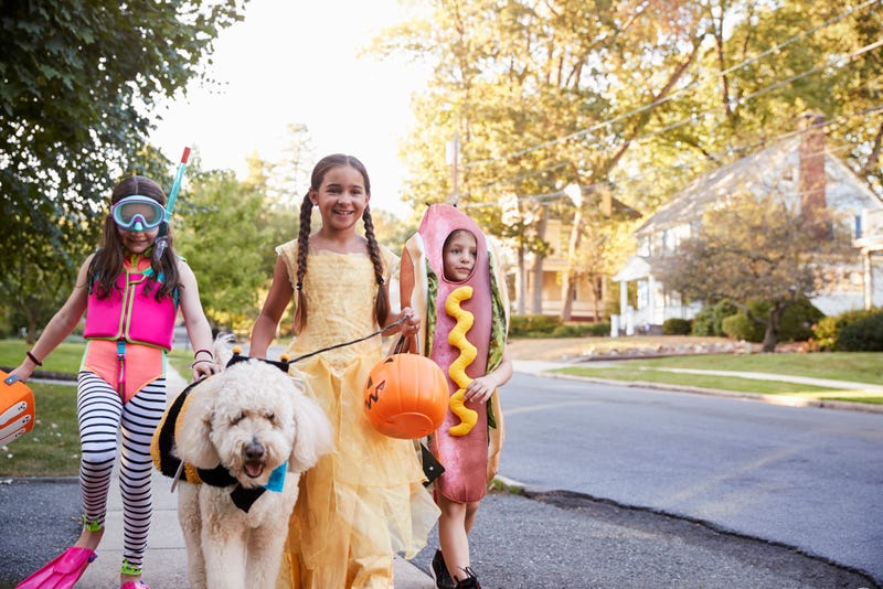 children trick or treating on street