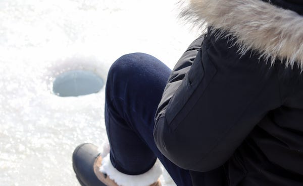 Man ice fishing