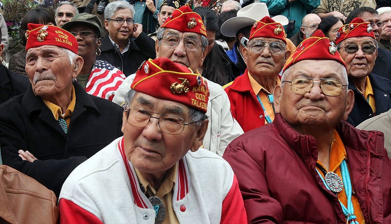 Members of the elite Navajo Code Talkers, the famed U.S. Marine unit who delivered unbreakable codes during World War II battles against the Japanese, look on before the start of the annual Veterans Day parade November 11, 2009 in New York City.