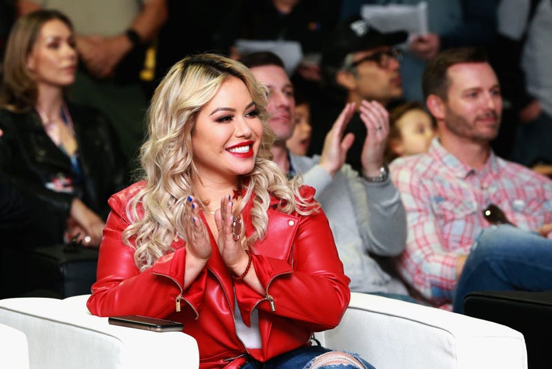 Chiquis Rivera is seen during the driver's meeting prior to the Monster Energy NASCAR Cup Series Auto Club 400 at Auto Club Speedway on March 18, 2018 in Fontana, California.
