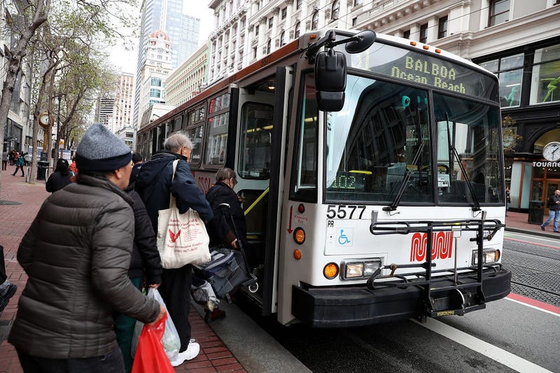 Passengers board a MUNI bus on March 21, 2018 in San Francisco, California.