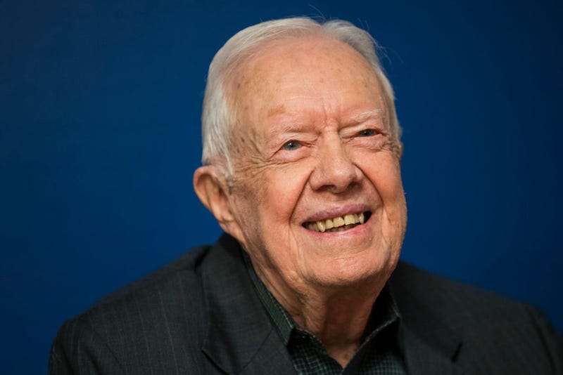 Former U.S. President Jimmy Carter smiles during a book signing event for his new book 'Faith: A Journey For All' at Barnes & Noble bookstore in Midtown Manhattan, March 26, 2018 in New York City.