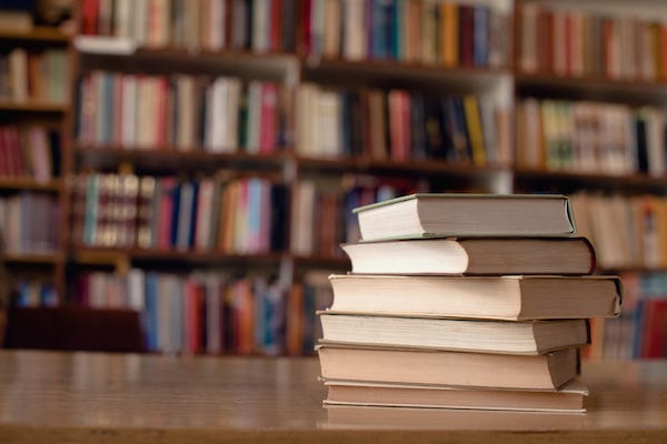 Books on a desk in a library