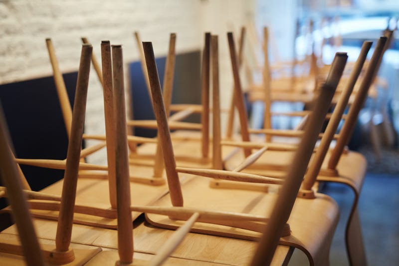 Chairs stacked in an empty restaurant